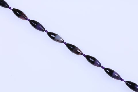 Strang Achat, lila schwarz, Olive facettiert, 12x30mm, 39cm